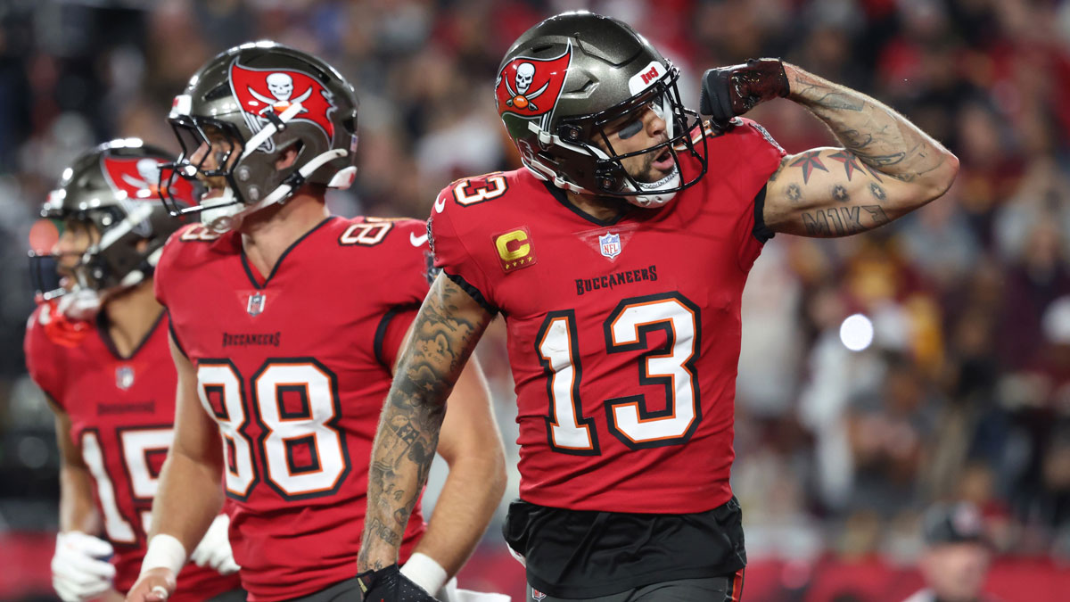 Jan 12, 2025; Tampa, Florida, USA; Tampa Bay Buccaneers wide receiver Mike Evans (13) celebrates after a touchdown catch with tight end Cade Otton (88) during the second quarter of a NFC wild card playoff against the Washington Commanders at Raymond James Stadium. Mandatory Credit: Kim Klement Neitzel-Imagn Images. Evans expects big things from the receivers including Chris Godwin.