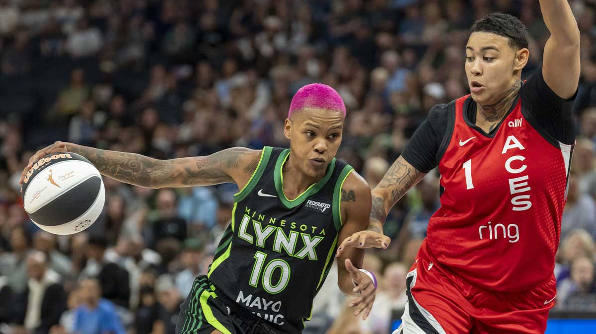 Minnesota Lynx guard Courtney Williams (10) drives to the basket past Las Vegas Aces forward Kierstan Bell (1) in the second half at Target Center.