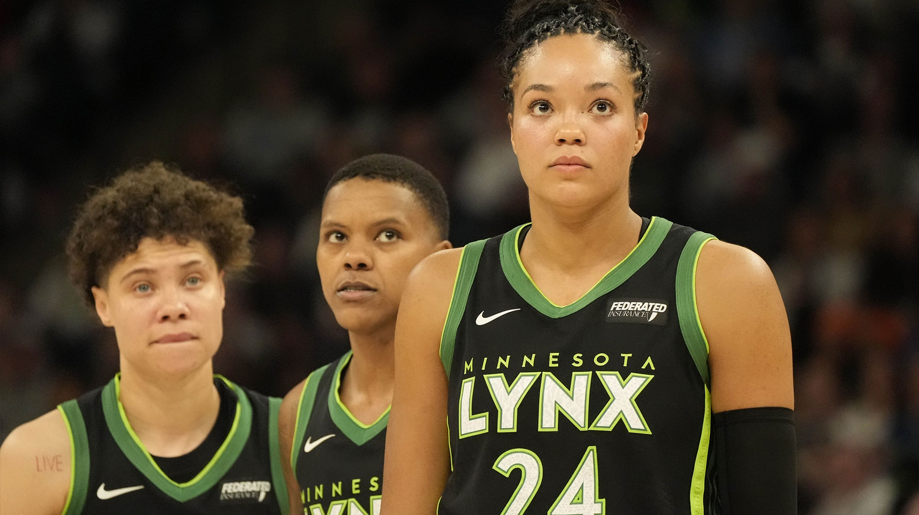 May 21, 2025; Minneapolis, Minnesota, USA; Minnesota Lynx guard Natisha Hiedeman (2), guard Courtney Williams (10) and forward Napheesa Collier (24) watch a free throw in the third quarter against the Dallas Wings at Target Center. Mandatory Credit: Bruce Kluckhohn-Imagn Images