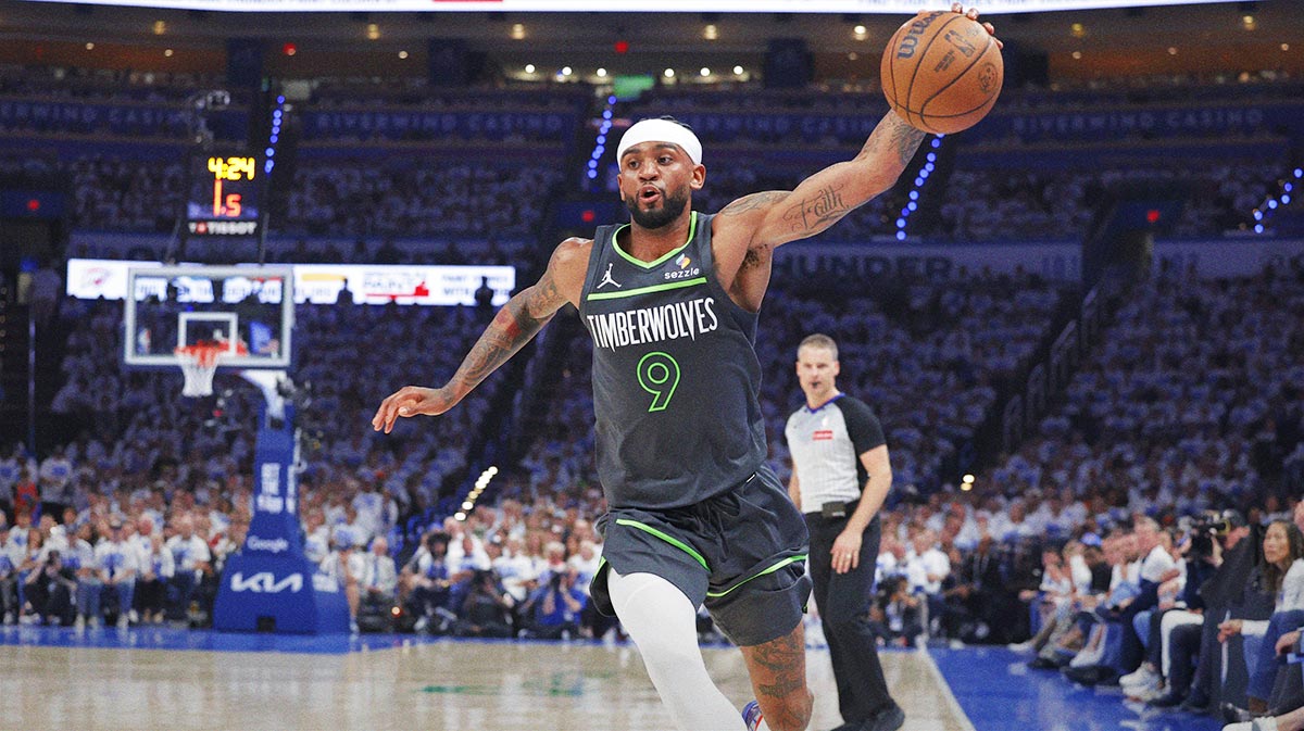 Minnesota Timberwolves guard Nickeil Alexander-Walker (9) saves a ball against the Oklahoma City Thunder in the second quarter during game one of the western conference finals for the 2025 NBA Playoffs at Paycom Center.