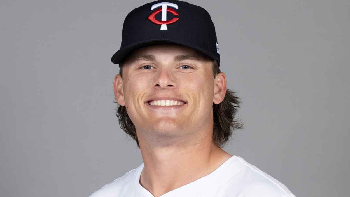 Minnesota Twins pitcher Travis Adams (82) takes photos during media day.