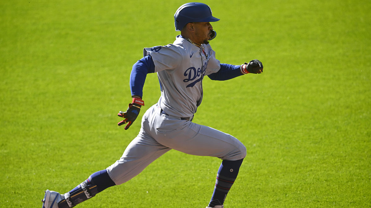Los Angeles Dodgers shortstop Mookie Betts (50) runs to first base in the first inning against the Cleveland Guardians at Progressive Field.