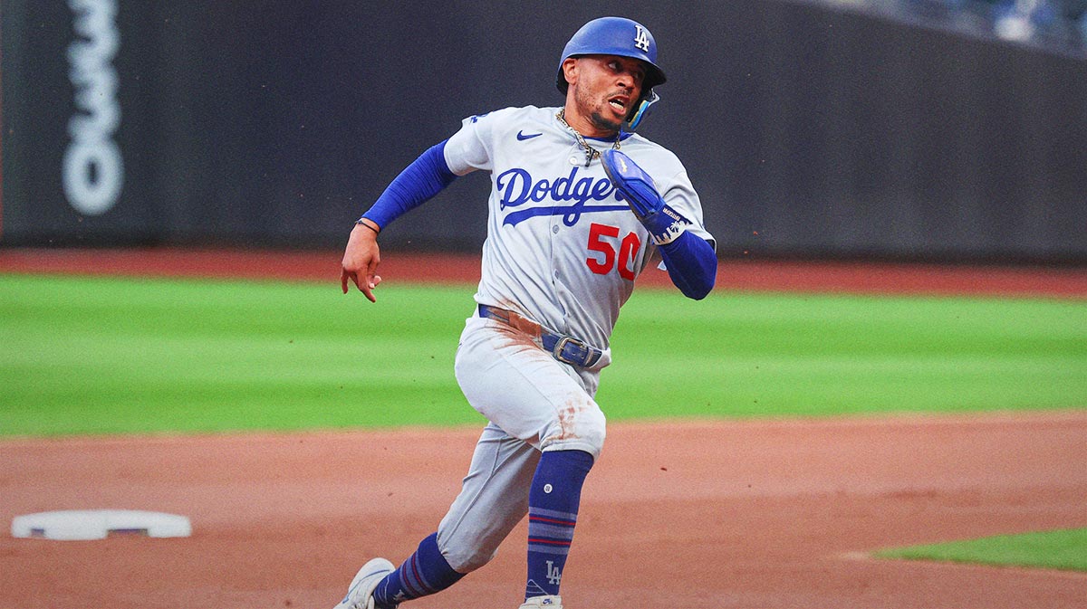 Los Angeles Dodgers shortstop Mookie Betts (50) rounds the bases during a double by first baseman Freddie Freeman ( p) during the first inning against the New York Mets at Citi Field.