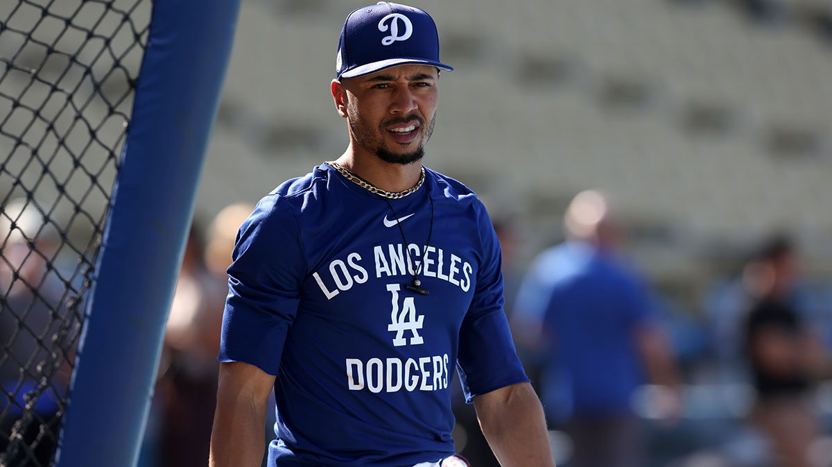 Los Angeles Dodgers shortstop Mookie Betts (50) warms up before a game against the New York Mets at Dodger Stadium.