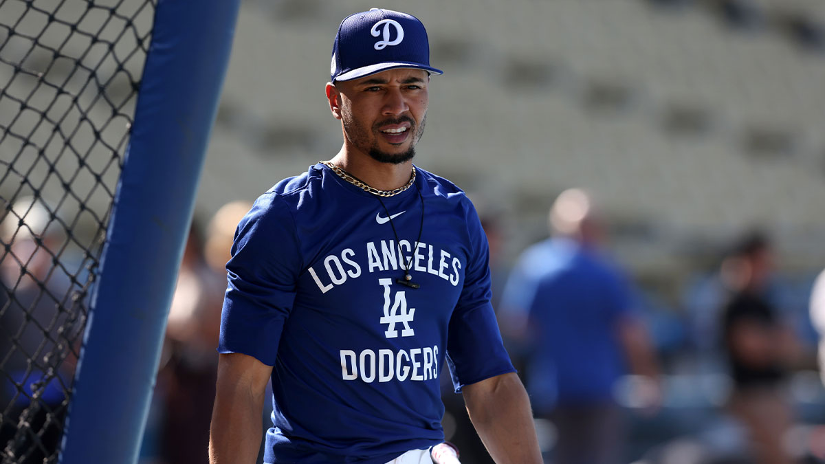 Jun 2, 2025; Los Angeles, California, USA; Los Angeles Dodgers shortstop Mookie Betts (50) warms up before a game against the New York Mets at Dodger Stadium. Mandatory Credit: Jason Parkhurst-Imagn Images
