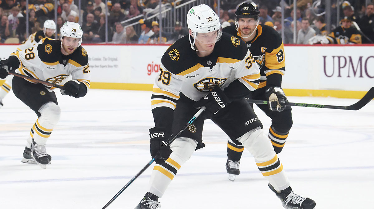 Boston Bruins center Morgan Geekie (39) skates with the puck against the Pittsburgh Penguins during the second period at PPG Paints Arena.