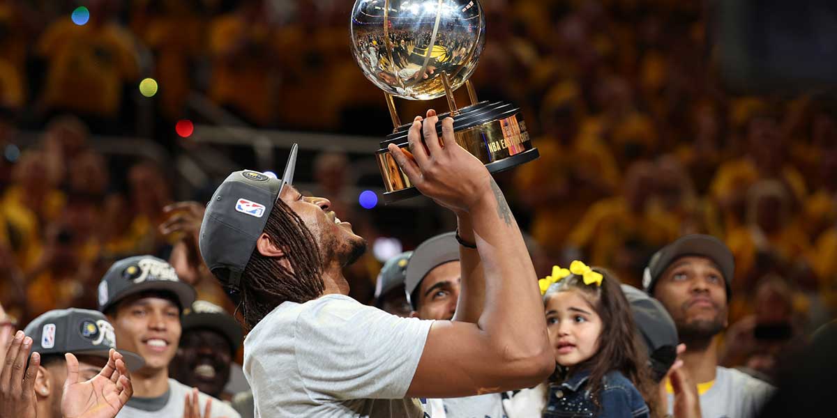 Indiana Pacers center Myles Turner (33) raises the trophy after game six of the eastern conference finals against the New York Knicks for the 2025 NBA Playoffs at Gainbridge Fieldhouse.