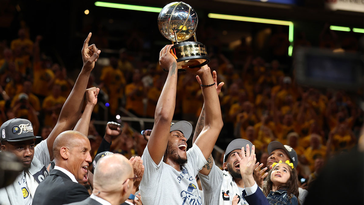 Indiana Pacers center Myles Turner (33) raises the trophy after game six of the eastern conference finals against the New York Knicks for the 2025 NBA Playoffs at Gainbridge Fieldhouse.