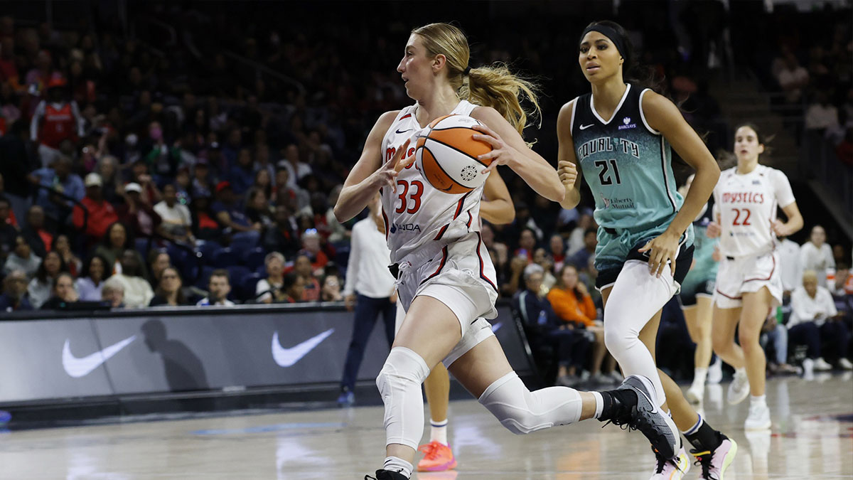 Washington Mystics guard Lucy Olsen (33) drives to the basket as New York Liberty forward Isabelle Harrison (21) chases in the second half at CareFirst Arena.