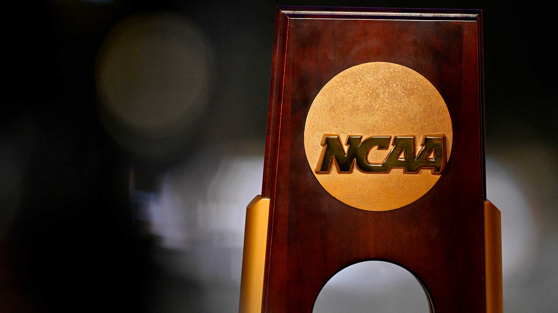 A view of the NCAA logo and trophy before the 2025 Women's National Gymnastics Championship at Dickies Arena.