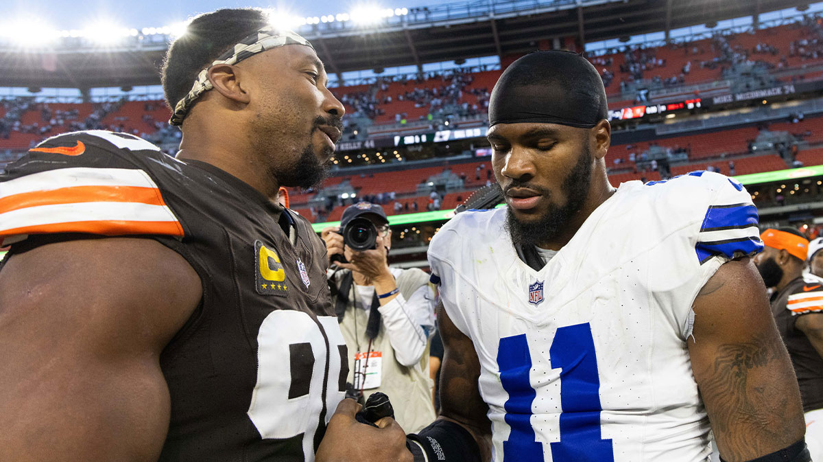 Cleveland Browns defensive end Myles Garrett (95) congratulates Dallas Cowboys linebacker Micah Parsons (11) after the game at Huntington Bank Field.