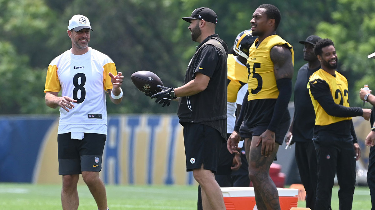Pittsburgh Steelers quarterback Aaron Rodgers (8) gets the ball during minicamp at their South Side facility.