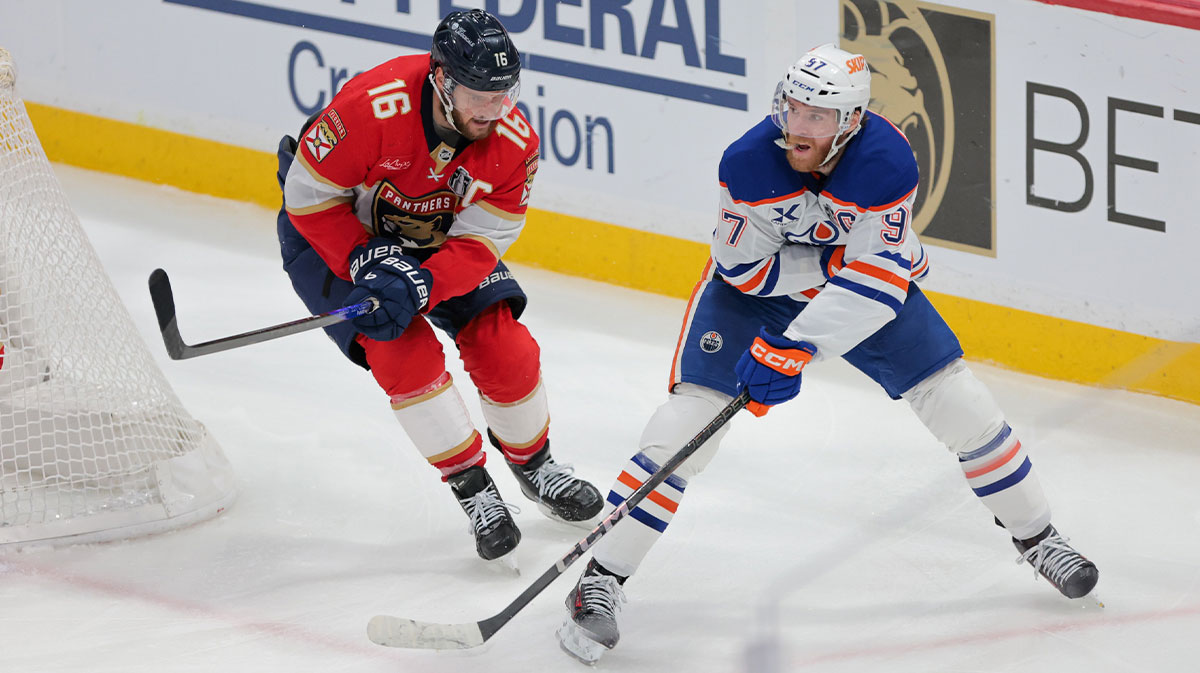 Edmonton Oilers center Connor McDavid (97) passes the puck away from Florida Panthers center Aleksander Barkov (16) during the third period in game six of the 2025 Stanley Cup Final at Amerant Bank Arena