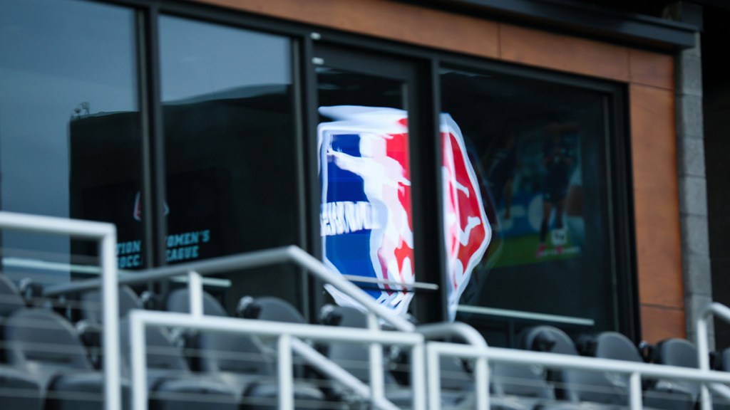 The National Womens Soccer League logo is reflected on the windows of the stadium before the game between Racing Louisville FC and San Diego Wave at Lynn Family Stadium.