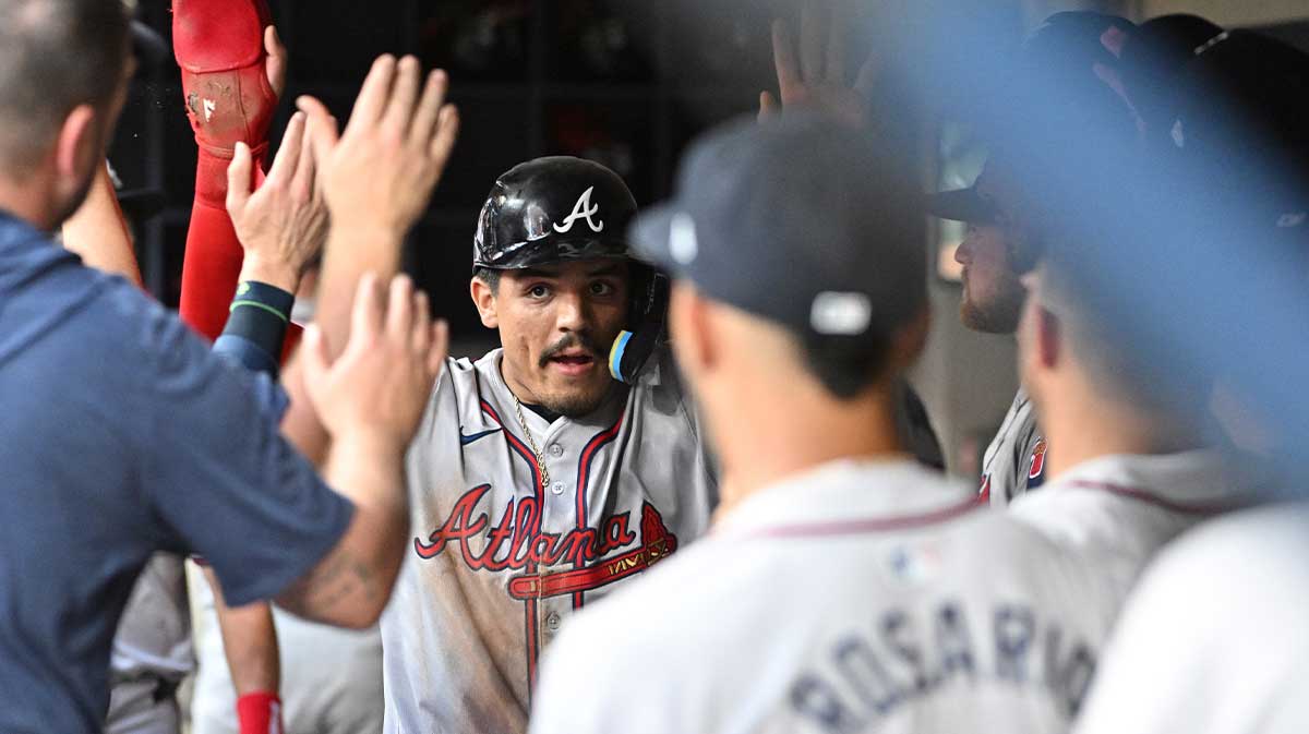 Atlanta Braves shortstop Nacho Alvarez Jr. (17) is congratulated after scoring a run against the Milwaukee Brewers in the third inning at American Family Field.