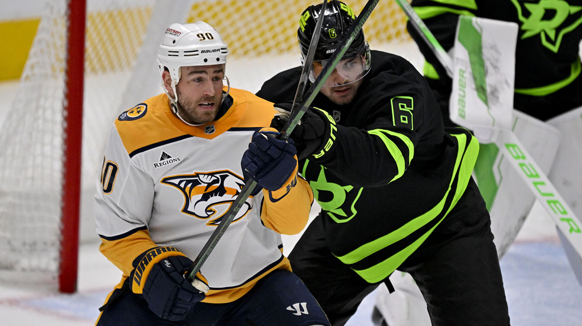 Nashville Predators center Ryan O'Reilly (90) and Dallas Stars defenseman Lian Bichsel (6) battle for position in the Dallas zone during the second period at the American Airlines Center