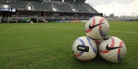 National Womens Soccer League (NWSL) soccer balls are seen on the field prior to a match between San Diego Wave FC and Racing Louisville FC at Lynn Family Stadium.