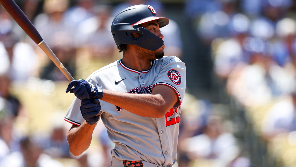 Washington Nationals left fielder James Wood (29) hits a single during the fifth inning against the Los Angeles Dodgers at Dodger Stadium.