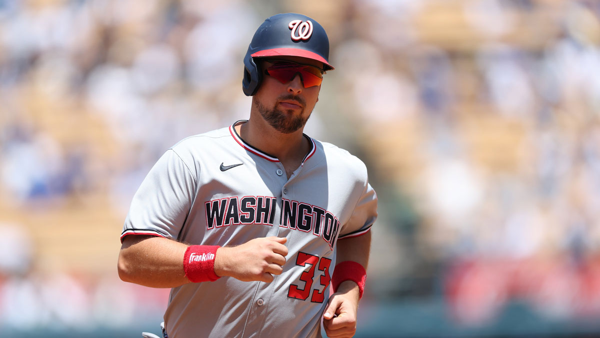 Washington Nationals first baseman Nathaniel Lowe (33) hits a home run during the third inning against The Los Angeles Dodgers at Dodger Stadium.