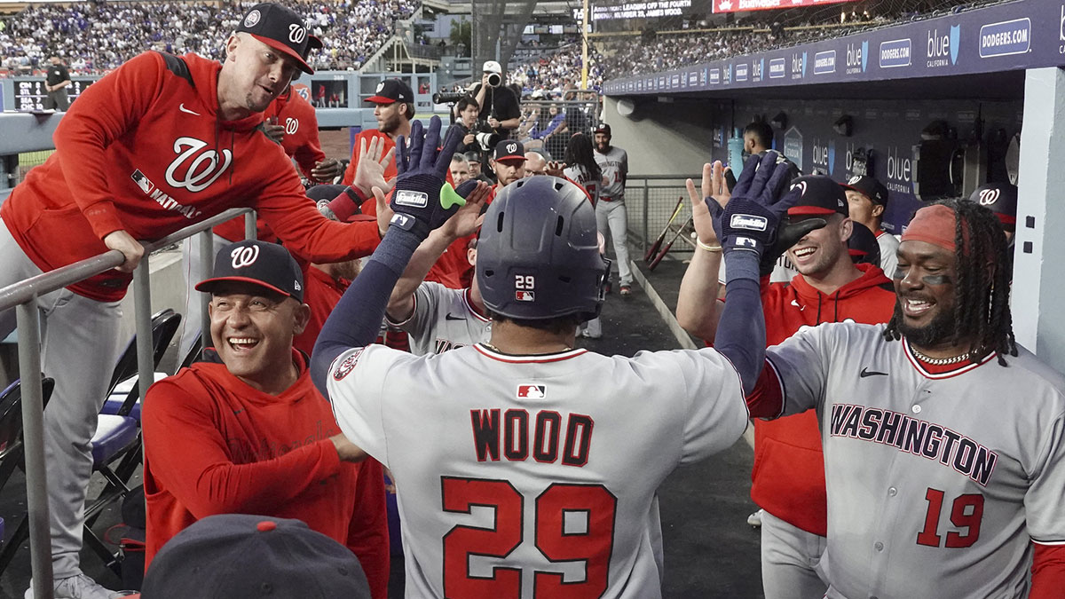 Washington Nationals outfielder James Wood (29) celebrates with teammates after scoring a home run in the third inning against the Los Angeles Dodgers at Dodger Stadium.