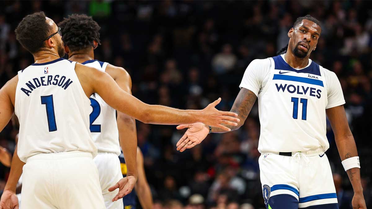 Minnesota Timberwolves center Naz Reid (11) celebrates with forward Kyle Anderson (1) during the first half against the Denver Nuggets at Target Center.