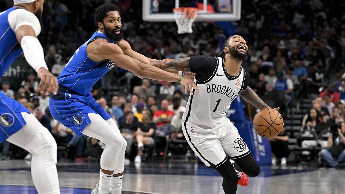 Nets guard D'Angelo Russell (1) drives to the basket past Dallas Mavericks guard Spencer Dinwiddie