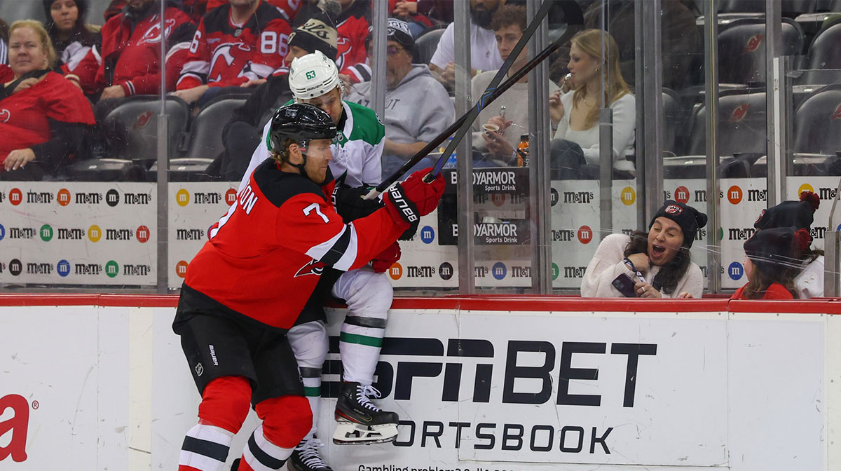 New Jersey Devils defenseman Dougie Hamilton (7) hits Dallas Stars right wing Evgenii Dadonov (63) during the third period at Prudential Center