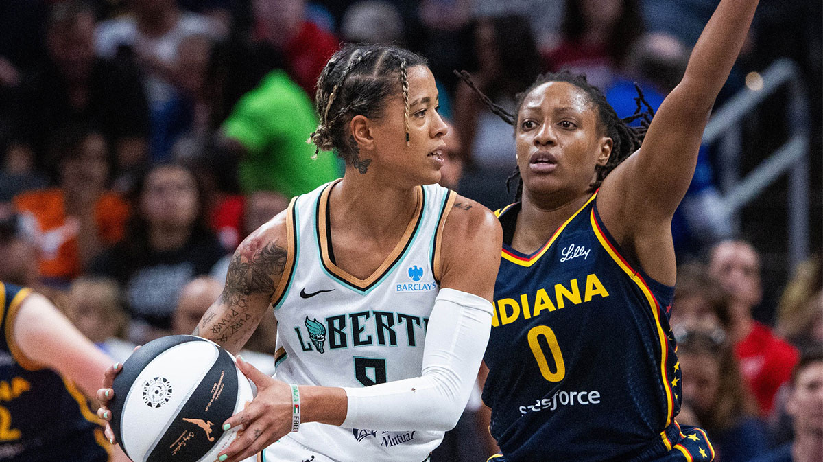 New York Liberty guard Natasha Cloud (9) holds the ball while Indiana Fever guard Kelsey Mitchell (0) defends in the first half at Gainbridge Fieldhouse.