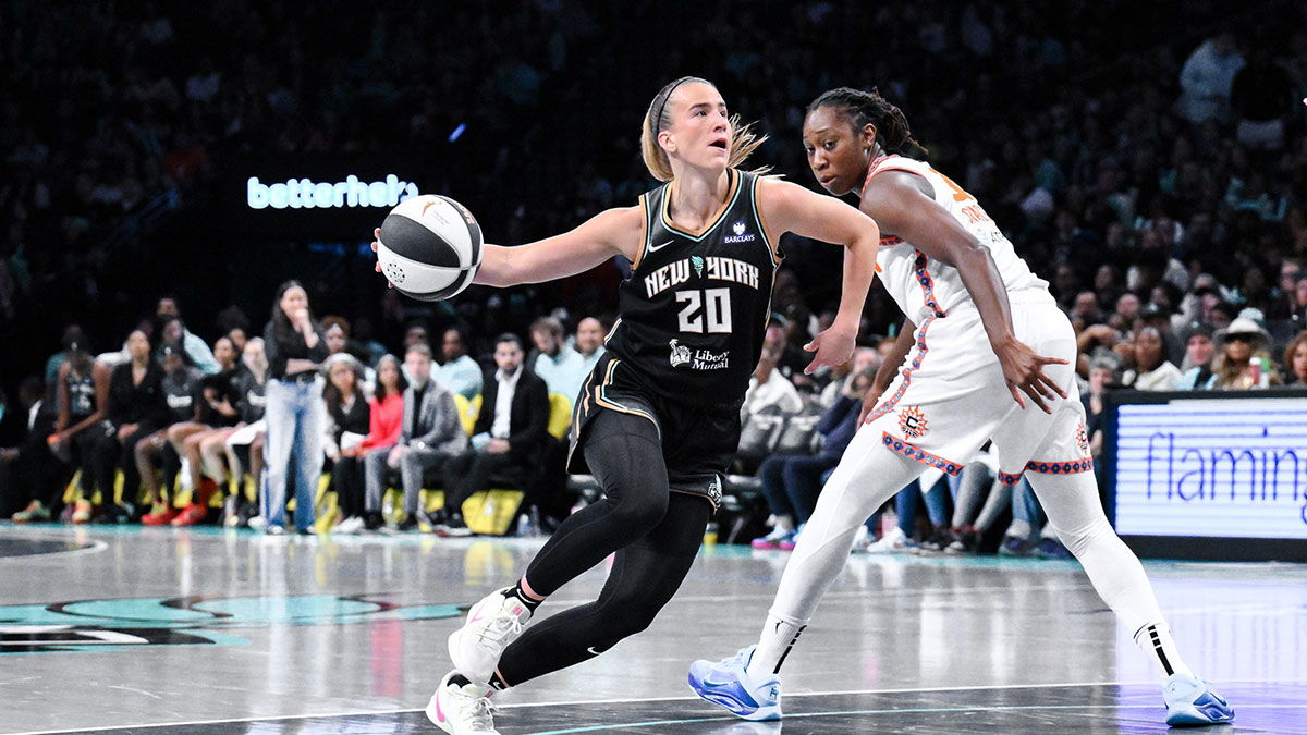 New York Liberty guard Sabrina Ionescu (20) drives past Connecticut Sun center Tina Charles (31) during the second half at Barclays Center.