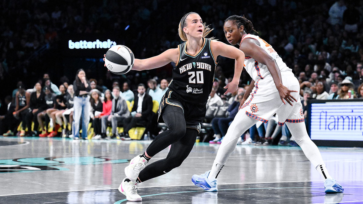 New York Liberty guard Sabrina Ionescu (20) drives past Connecticut Sun center Tina Charles (31) during the second half at Barclays Center.