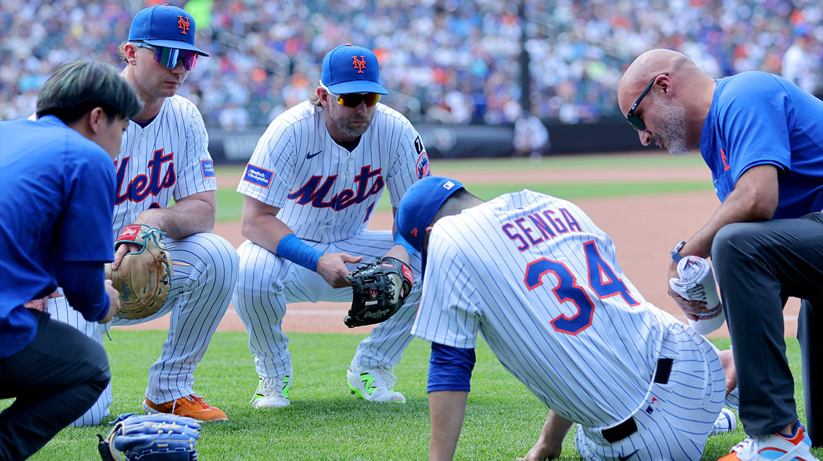 New York Mets first baseman Pete Alonso (20) and second baseman Jeff McNeil (1) watch as starting pitcher Kodai Senga (34) is tended to after sustaining an injury during the sixth inning against the Washington Nationals at Citi Field.