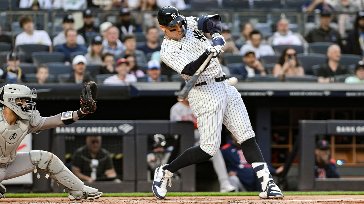 New York Yankees outfielder Aaron Judge (99) hits a two-run home run off Hunter Dobbins against the Boston red Sox during the first inning at Yankee Stadium.