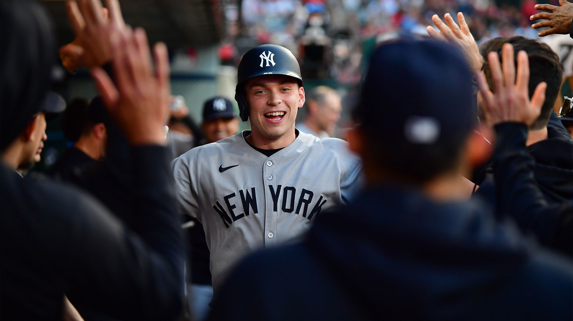 New York Yankees designated hitter Ben Rice (22) is greeted after hitting a solo home run against the Los Angeles Angels during the fourth inning at Angel Stadium.
