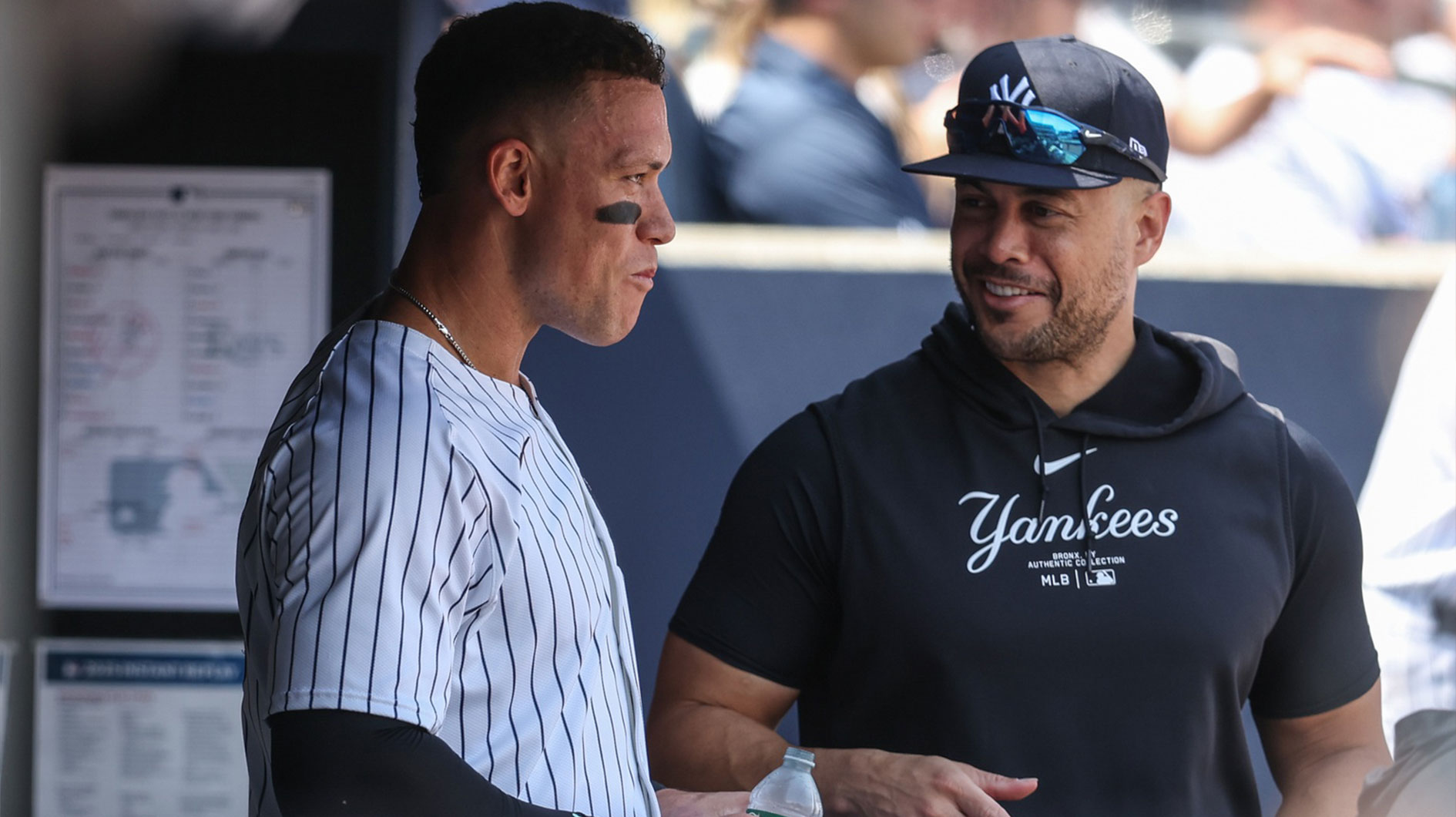New York Yankees right fielder Aaron Judge (99) talks with GIancarlo Stanton (27) after hitting a solo home run in the first inning against the Tampa Bay Rays at Yankee Stadium.