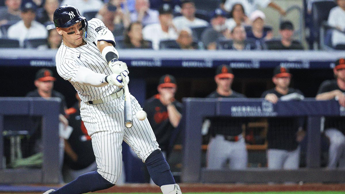 New York Yankees right fielder Aaron Judge (99) hits a single in the sixth inning against the Baltimore Orioles at Yankee Stadium.