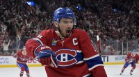 Montreal Canadiens forward Nick Suzuki (14) celebrates after scoring a goal against the Washington Capitals during the second period in game three of the first round of the 2025 Stanley Cup Playoffs at the Bell Centre