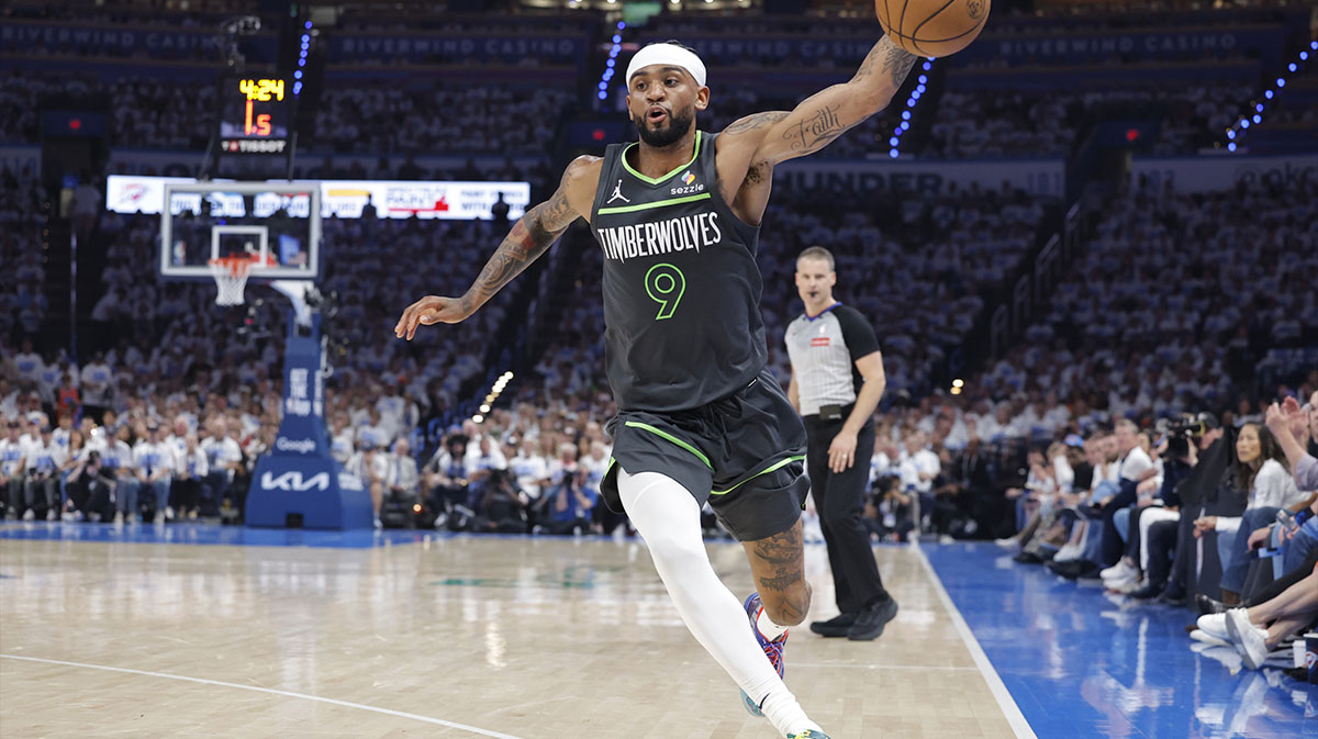 Minnesota Timberwolves guard Nickeil Alexander-Walker (9) saves a ball against the Oklahoma City Thunder in the second quarter during game one of the western conference finals for the 2025 NBA Playoffs at Paycom Center.