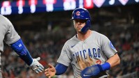 Chicago Cubs second baseman Nico Hoerner (2) walks back the to dugout after scoring a run during the ninth inning against the Washington Nationals at Nationals Park.
