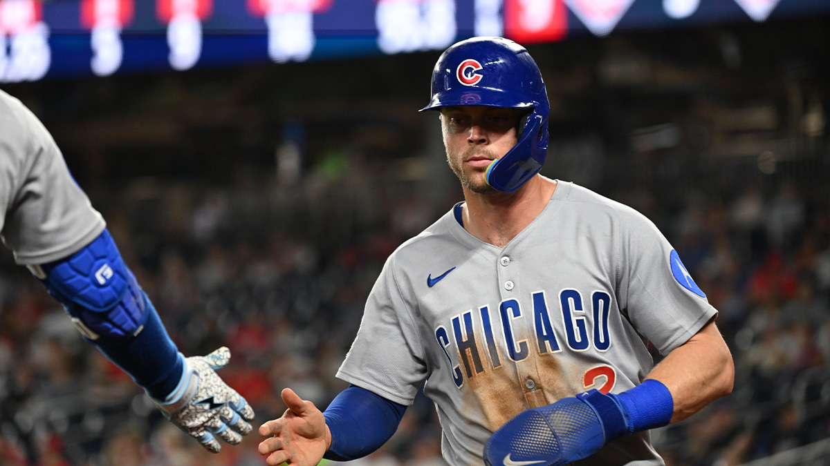 Chicago Cubs second baseman Nico Hoerner (2) walks back the to dugout after scoring a run during the ninth inning against the Washington Nationals at Nationals Park.