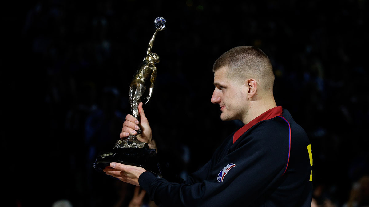 Denver Nuggets center Nikola Jokic (15) gestures with the KIA NBA MVP trophy to his teammates before game five against the Minnesota Timberwolves in the second round for the 2024 NBA playoffs at Ball Arena.