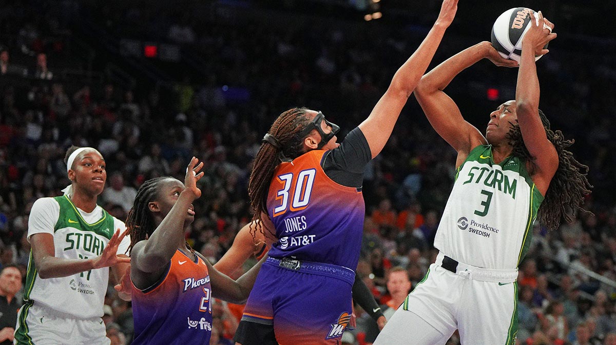 Seattle Storm forward Nneka Ogwumike (3) shoots over Phoenix Mercury center Murjanatu Musa (20) and guard Haley Jones (30) in the first half at Footprint Center.