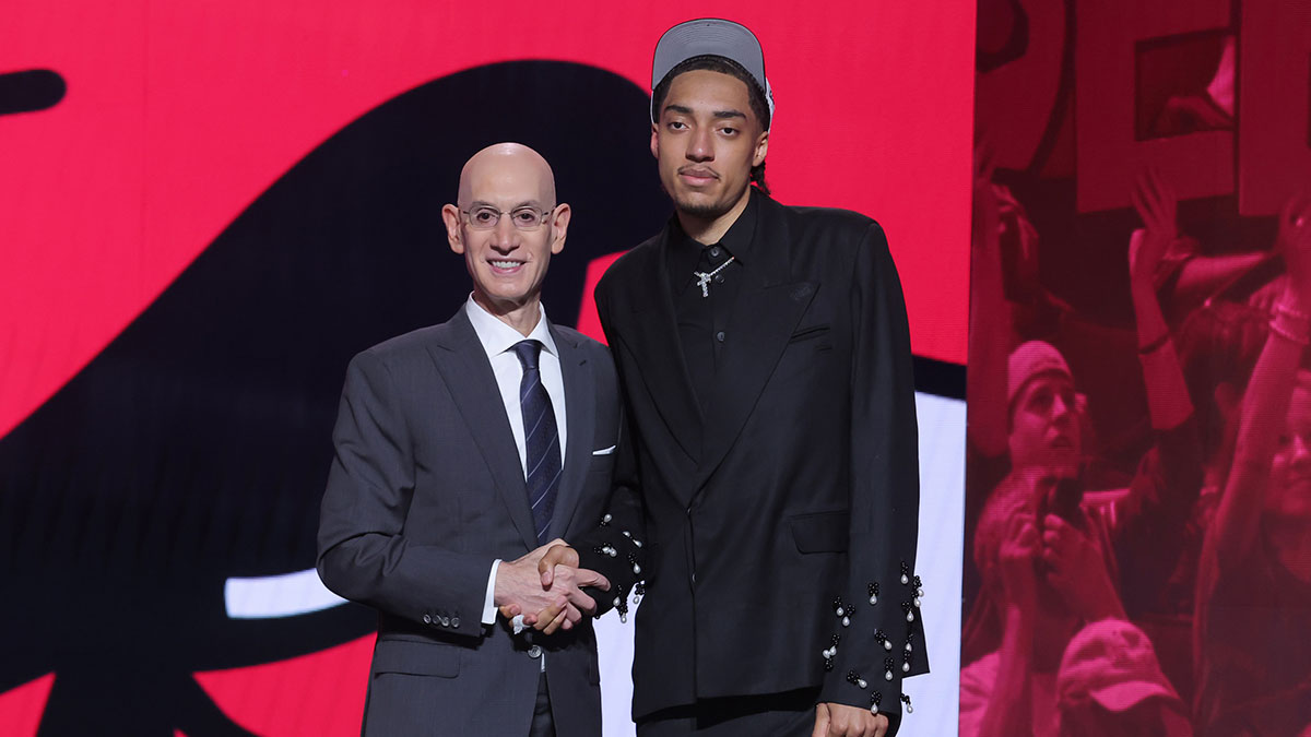 Noa Essengue stands with NBA commissioner Adam Silver after being selected as the 12th pick by the Chicago Bulls in the first round of the 2025 NBA Draft at Barclays Center.