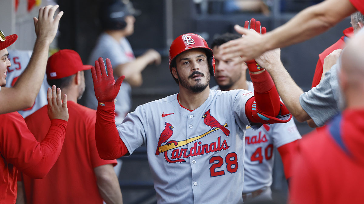 St. Louis Cardinals third baseman Nolan Arenado (28) celebrates with teammates in the dugout after hitting a solo home run against the Chicago White Sox during the third inning of game two of a doubleheader at Rate Field.