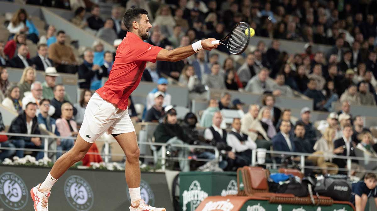 Novak Djokovic of Serbia returns a shot during his match against Alexander Zverev of Germany on day 11 at Roland Garros Stadium.