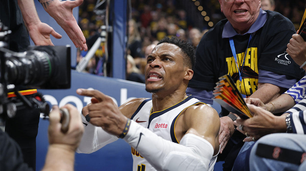 Denver Nuggets guard Russell Westbrook (4) reacts after a play and falling into fans in the second quarter against the Oklahoma City Thunder during game two of the second round for the 2025 NBA Playoffs at Paycom Center.