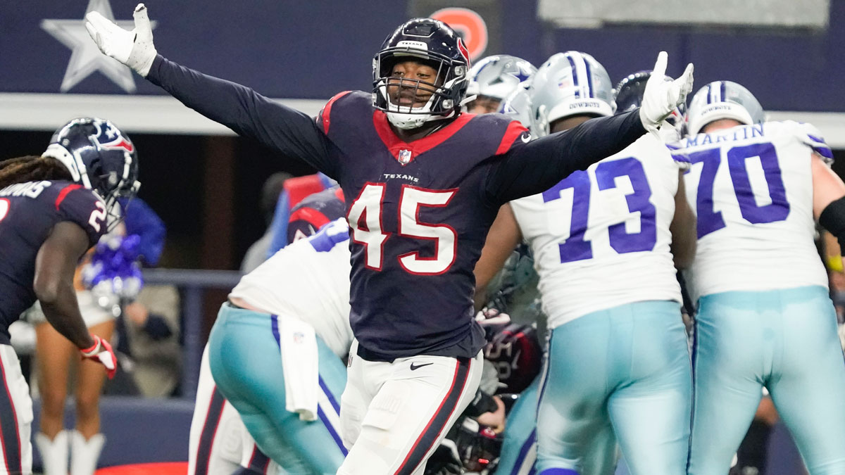 Dec 11, 2022; Arlington, Texas, USA; Houston Texans linebacker Ogbonnia Okoronkwo (45) reacts after a turnover by the Dallas Cowboys during the second half at AT&T Stadium. Mandatory Credit: Raymond Carlin III-Imagn Images