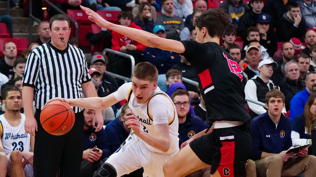 Whitnall's Myles Herro (2) battles to get past La Crosse Central's Bennett Fried (12) during the WIAA Division 2 state boys basketball semifinal at the Kohl Center in Madison on Friday, March 17, 2023.
