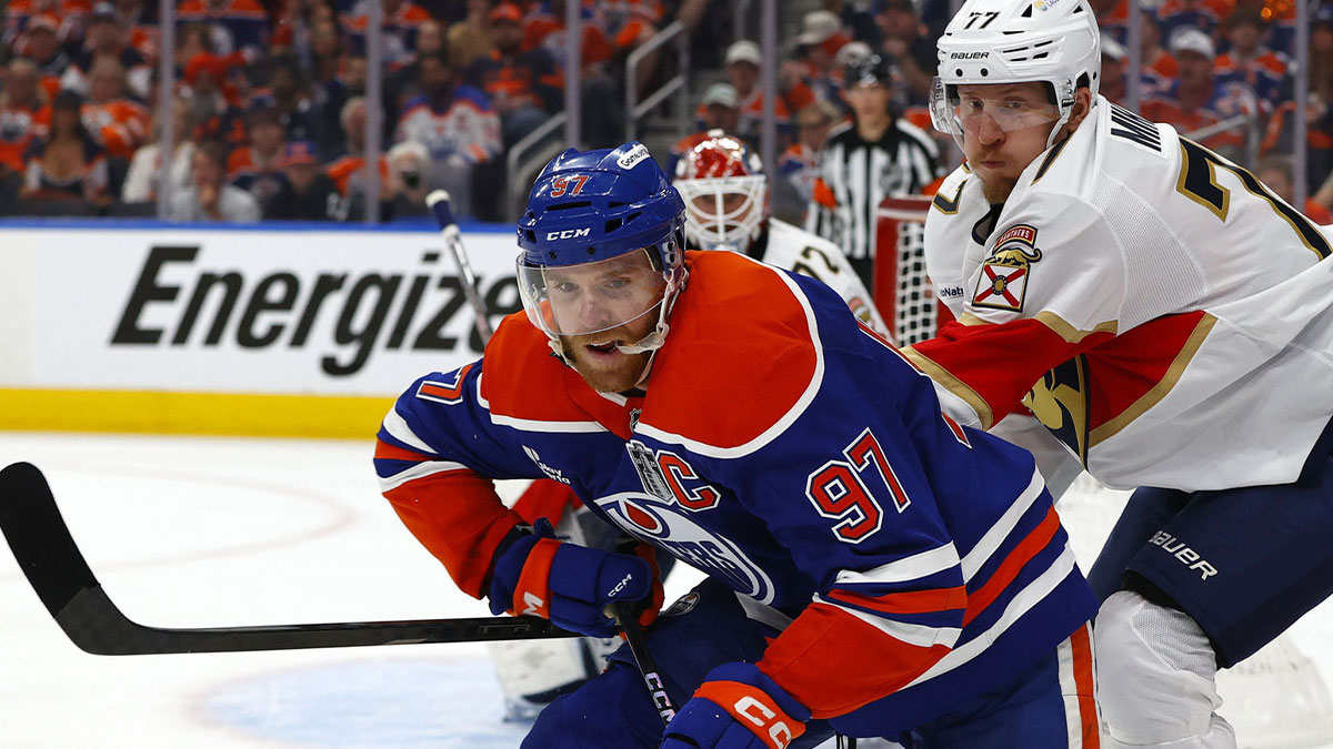 Edmonton Oilers center Connor McDavid (97) skates past Florida Panthers defenseman Niko Mikkola (77) in the first period in game one of the 2025 Stanley Cup Final at Rogers Place.