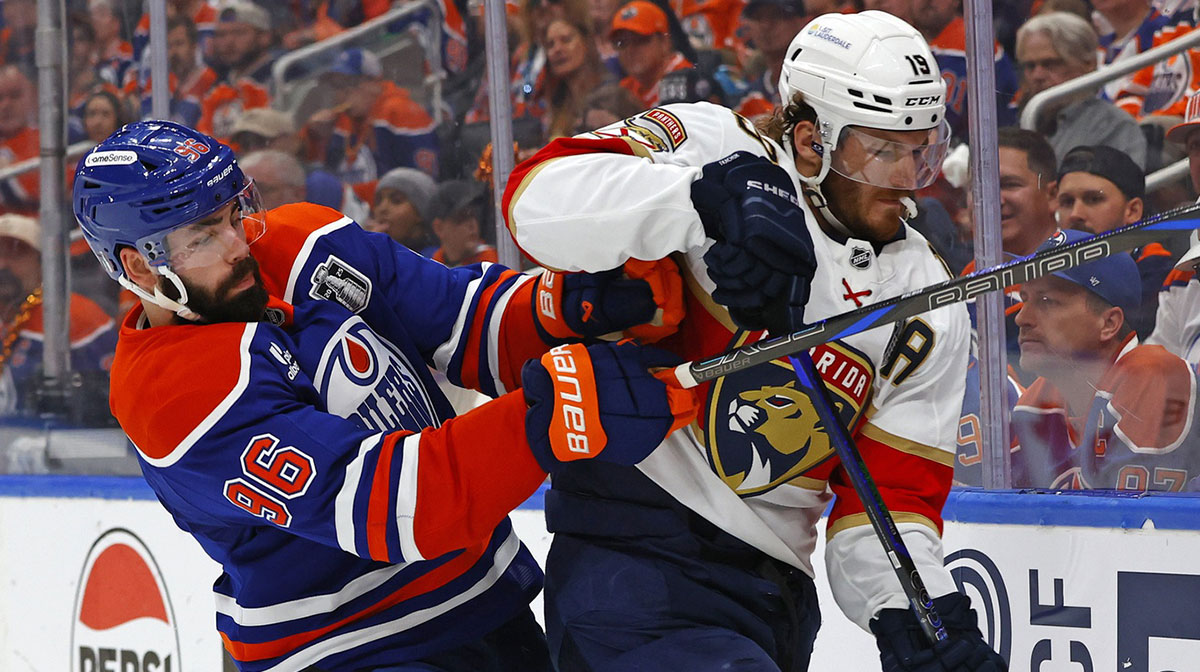 Edmonton Oilers defenseman Jake Walman (96) checks Florida Panthers left wing Matthew Tkachuk (19) during the second period in game two of the 2025 Stanley Cup Final at Rogers Place
