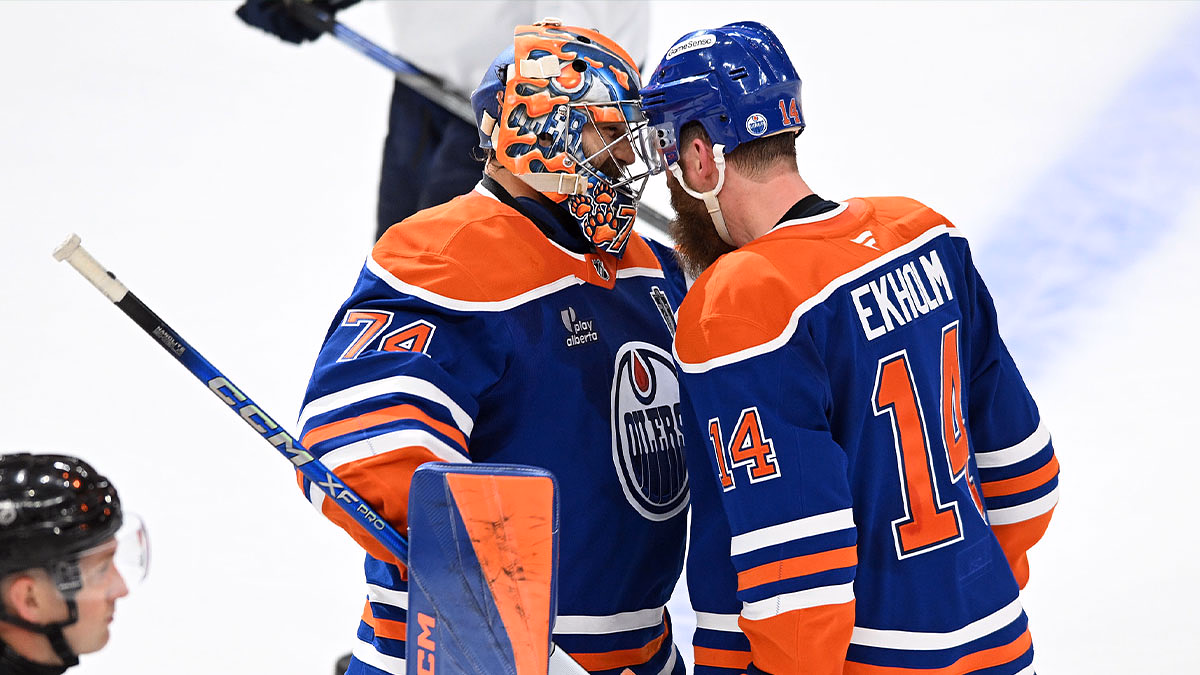 Edmonton Oilers goaltender Stuart Skinner (74) reacts with defenseman Mattias Ekholm (14) after defeating the Florida Panthers in overtime for game one of the 2025 Stanley Cup Final at Rogers Place.